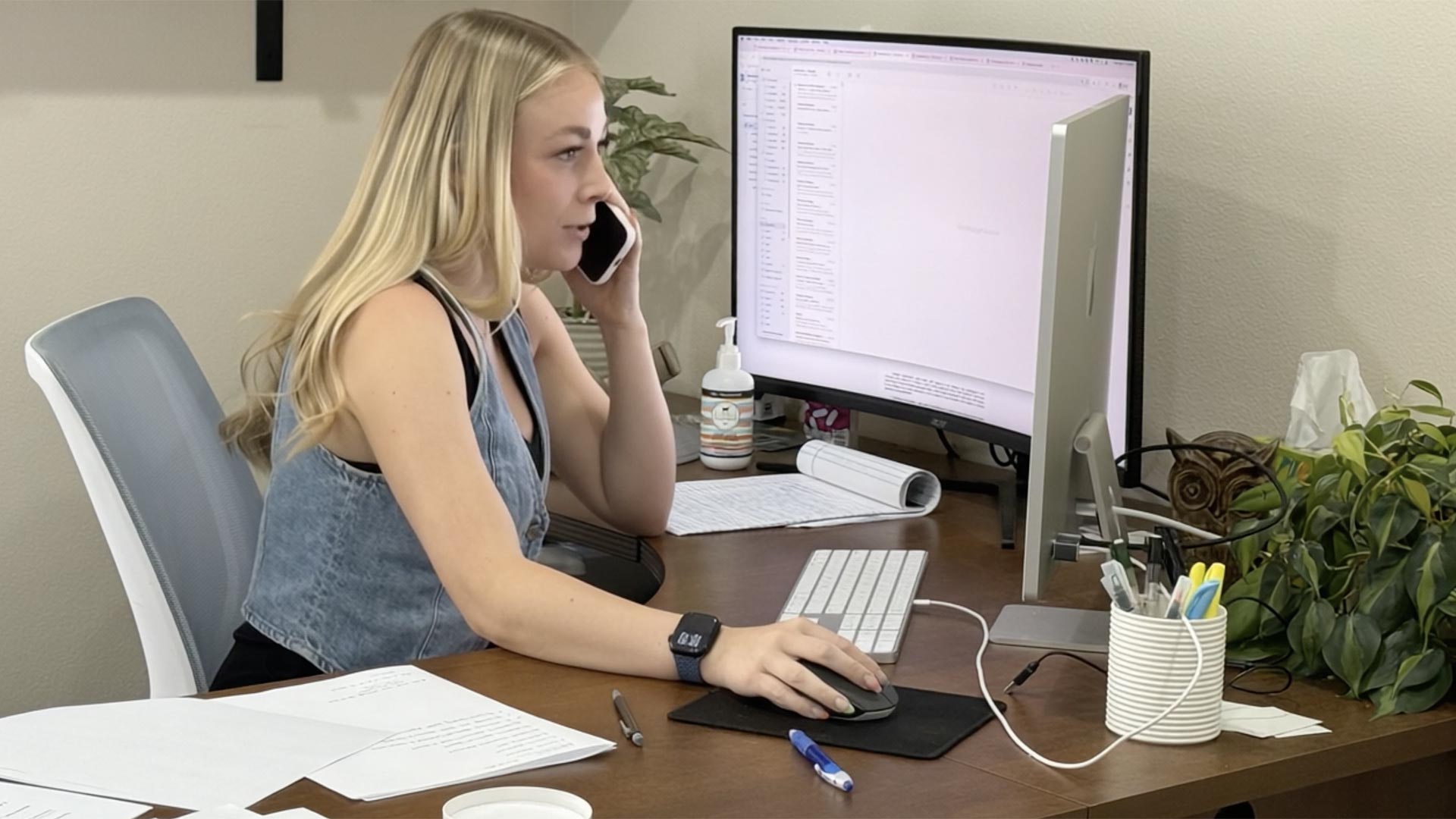 Allie Larson placing the call from her desk at ReadyPod